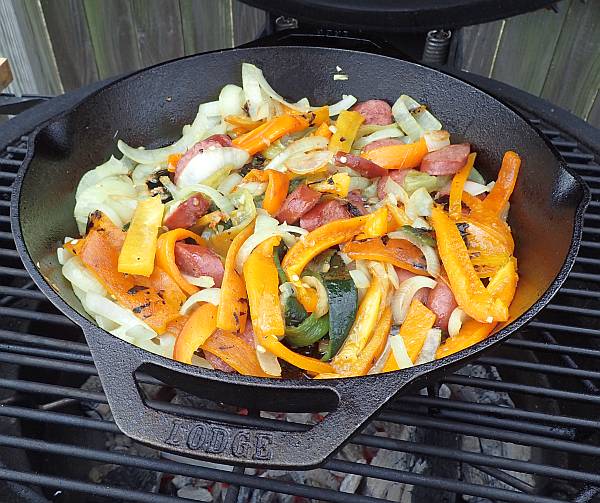 fire roasted peppers onions and sausage for our grilled sausage and peppers sandwich