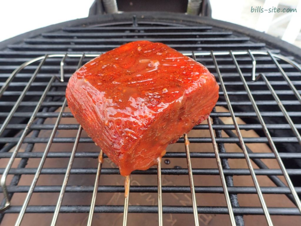 applying the first layer of barbecue sauce