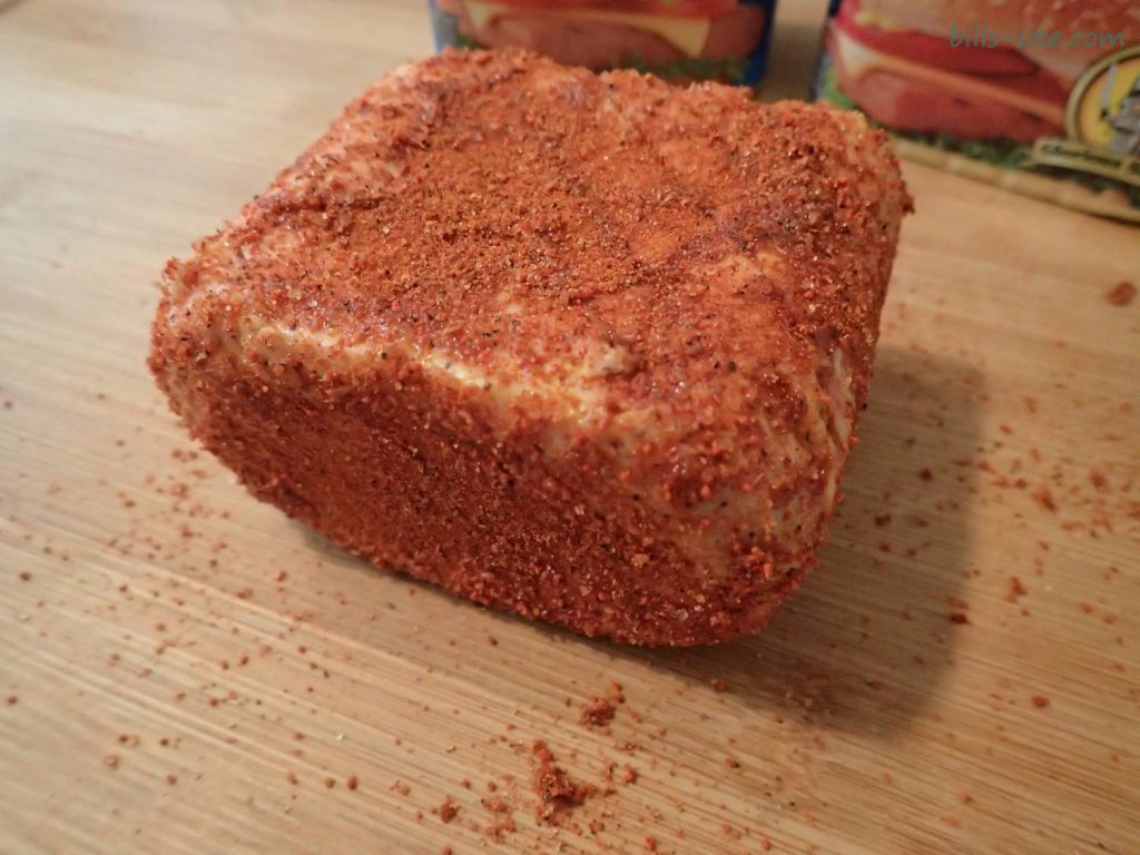 applying the first layer of barbcue rub