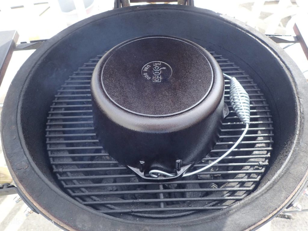 seasoning the Lodge five quart cast iron dutch oven on the grill