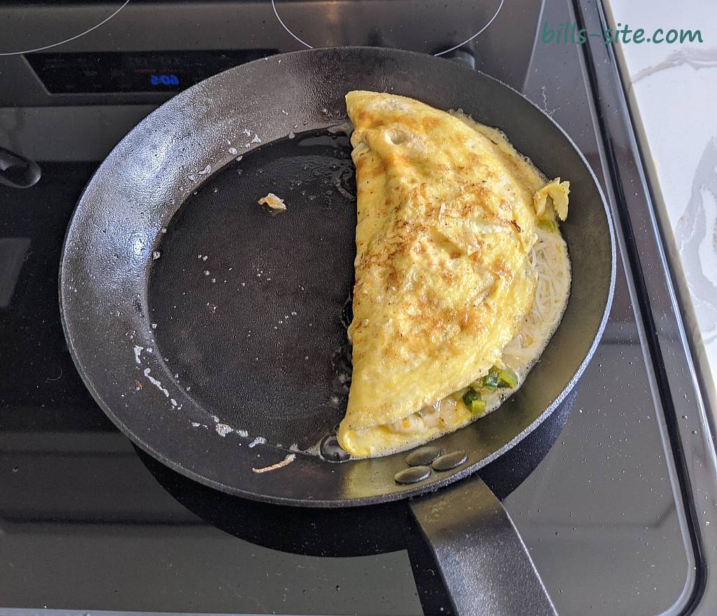 cooking up an omlet on our Lodge CRS10 carbon steel skillet.