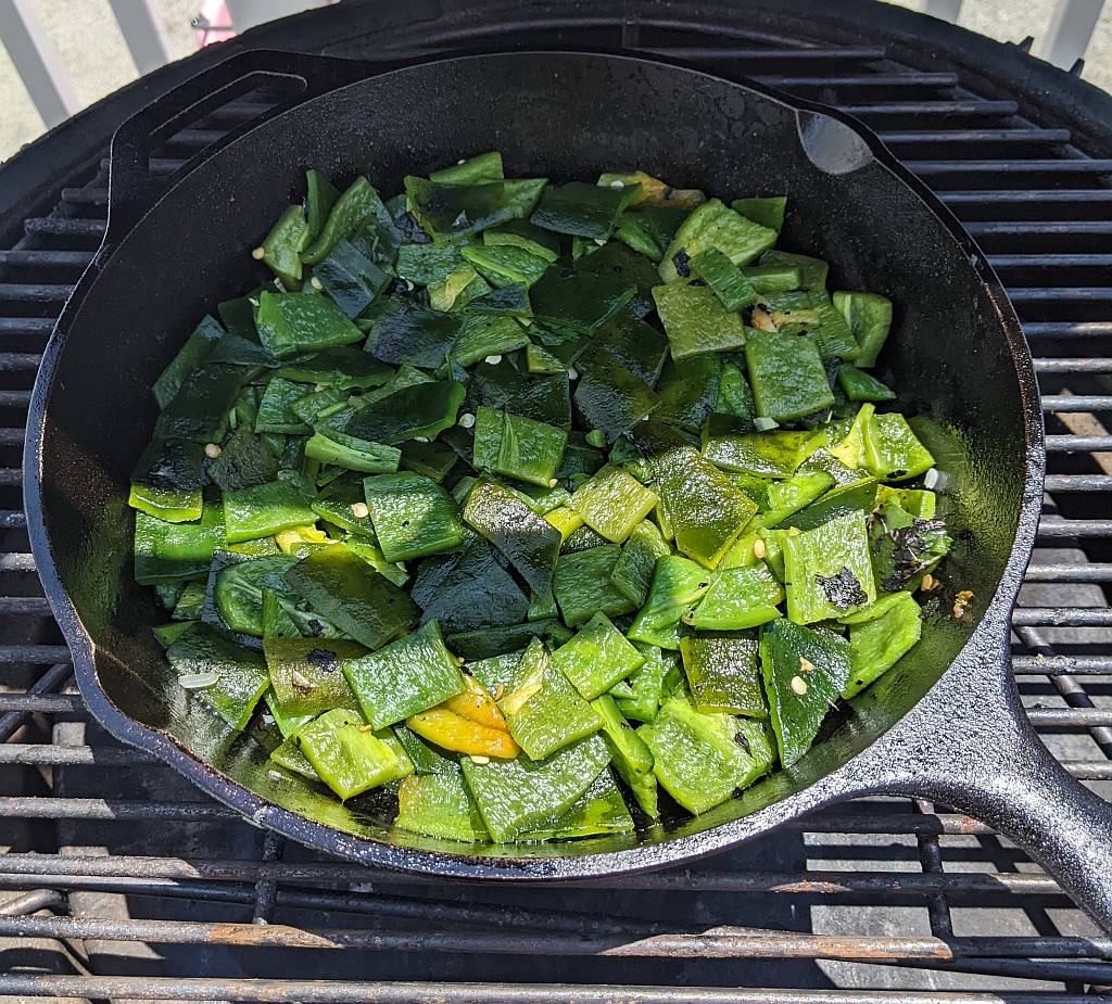 layer of fire-roasted poblano peppers in the skillet