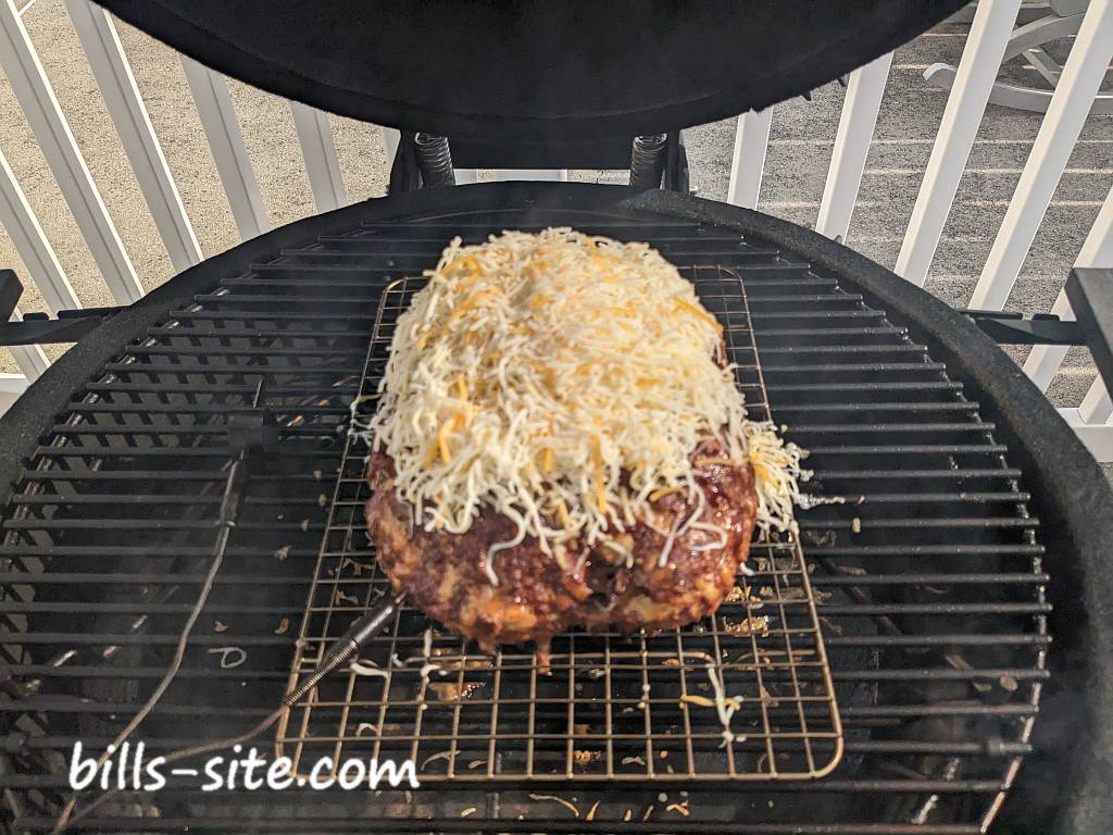 smoked taco meatloaf with cheese placed on top